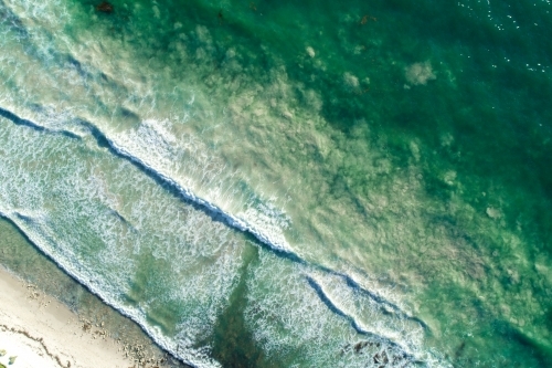 Waves rolling into a shoreline - Australian Stock Image