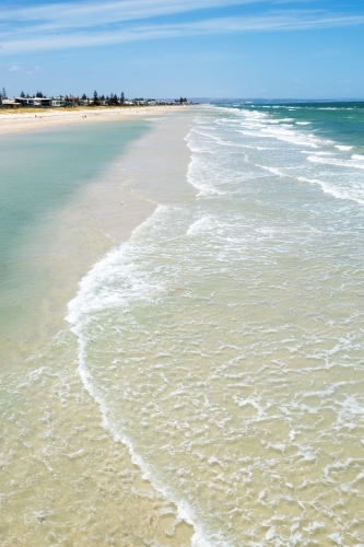 waves washing over sand bar at city beach - Australian Stock Image