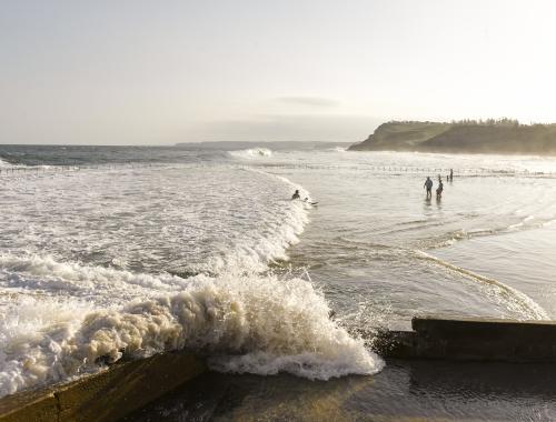 Wavesd crashing onto Newcastle Ocean Baths 09 - Australian Stock Image