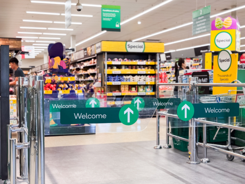 welcome signs at the entrance of of a supermarket - Australian Stock Image