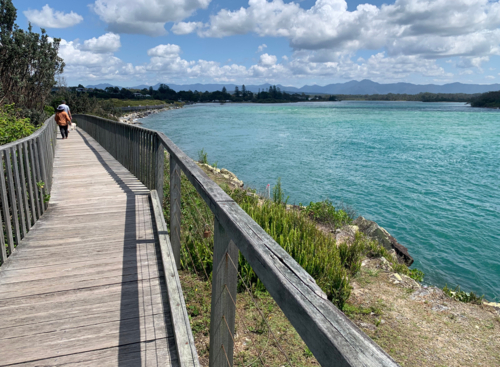 wheelchair friendly boardwalk by a river - Australian Stock Image