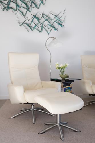White Leather chair with ottoman - Australian Stock Image