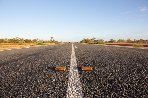 White line and cats-eye reflectors on an outback highway