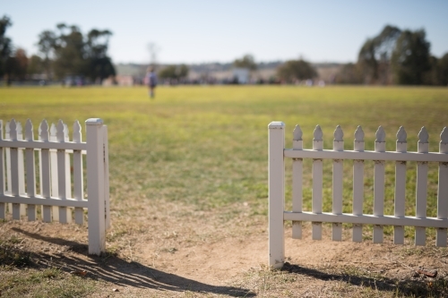 White picket fence at a sporting ground