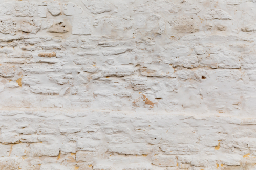 white rustic sandstone rendered wall - Australian Stock Image