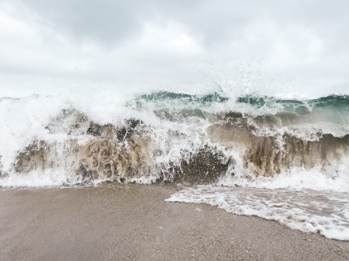 Whitewash waves crashing on the shore
