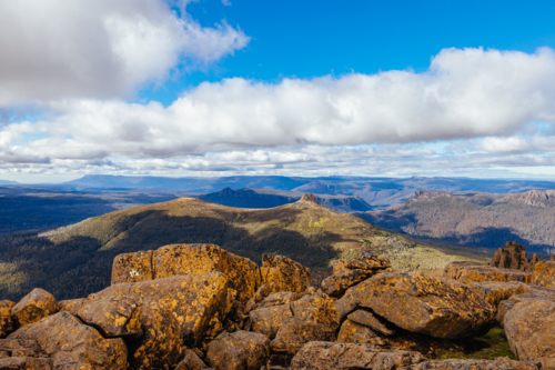 Wide landscape views from the summit of Mt Ossa and surrounds on a clear warm autumn afternoon - Australian Stock Image