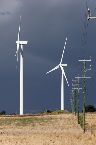Wind turbines and power line in a paddock - Australian Stock Image