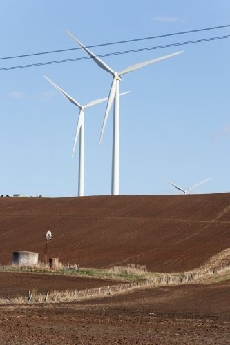 Wind turbines in tilled paddock - Australian Stock Image