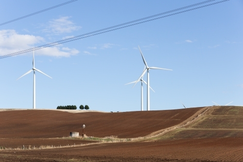 Wind turbines in tilled paddocks - Australian Stock Image