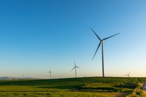 wind turbines on rolling farmland - Australian Stock Image