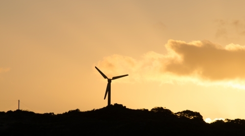 Windmill silhouette at sunset