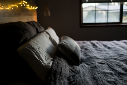 Window light on linen bedspread