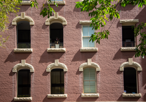 Windows with sandstone lintels and arches - Australian Stock Image