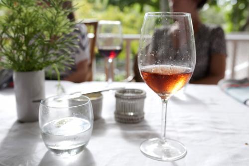 Wine on table with friends - Australian Stock Image