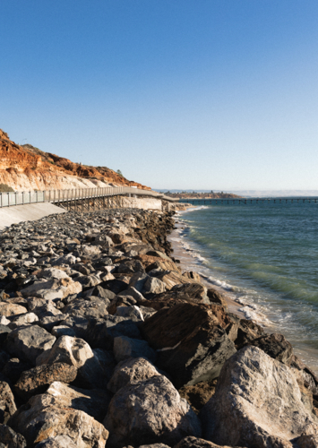 Witton Bluff Base Trail sea wall at Port Noarlunga - Australian Stock Image