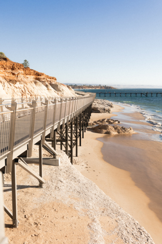 Witton Bluff Base Trail with Port Noarlunga Jetty in background - Australian Stock Image