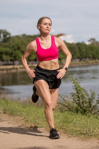 Woman exercising by the River - Australian Stock Image