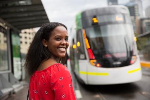 Woman Hurrying to Catch the Tram - Australian Stock Image