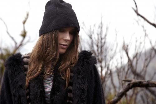 Woman in beanie looking down - Australian Stock Image