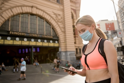 Woman in Face Mask Waiting at Flinders Street Station