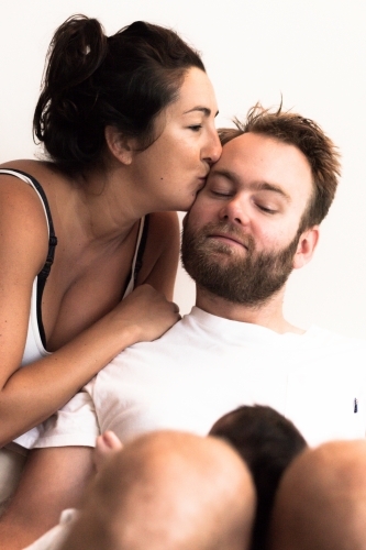 Woman kissing man - Australian Stock Image