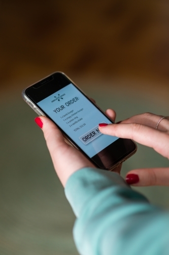 woman ordering takeaway food online - Australian Stock Image