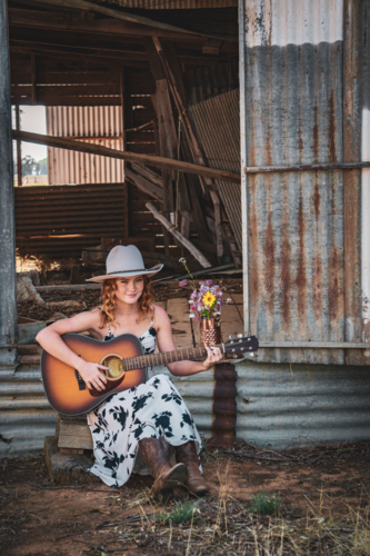 Woman playing guitar - Australian Stock Image