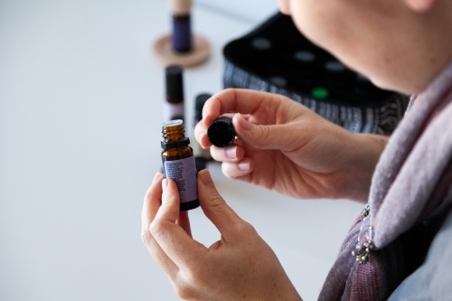 woman selling essential oils - Australian Stock Image
