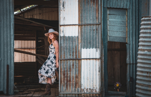 Woman standing in a woolshed - Australian Stock Image