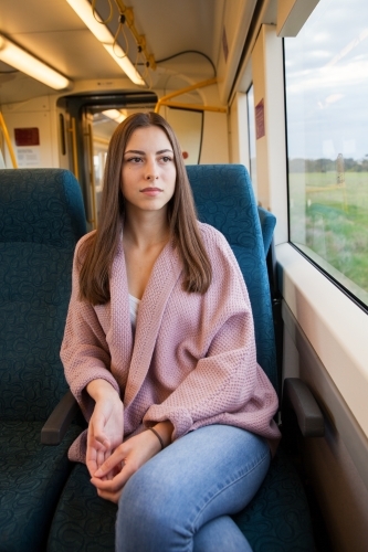 Woman Traveling on a train in Victoria - Australian Stock Image