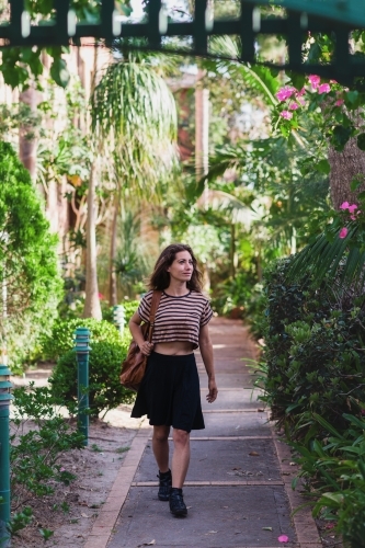 woman walking in garden - Australian Stock Image