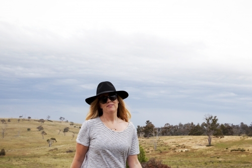 Woman walking on a farm - Australian Stock Image
