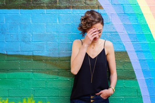 woman with head bowed - Australian Stock Image