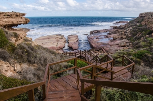 Wooden boardwalk leading down to the edge of a cliff - Australian Stock Image