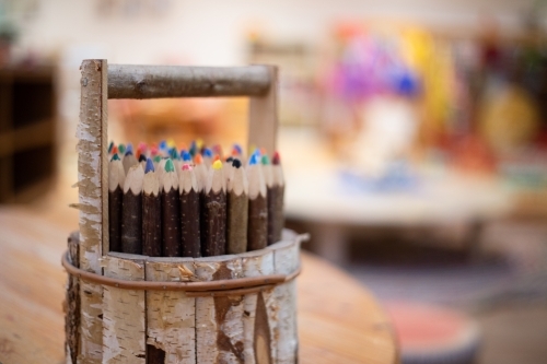Wooden pencil holder with coloured pencils