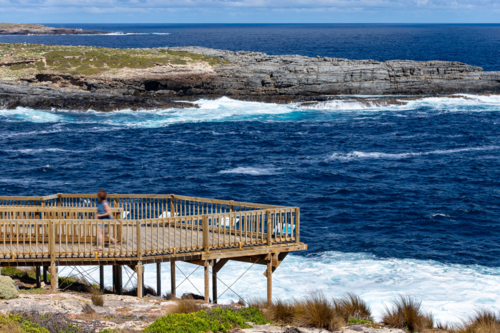 Wooden Viewing Platform lookout at Admirals Arch with Crashing Waves, Kangaroo Island - Australian Stock Image