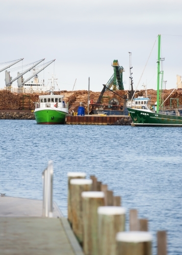 Working port and machinery with jetty in foreground - Australian Stock Image