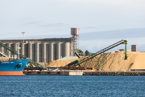 Working port and machinery with silos in background - Australian Stock Image