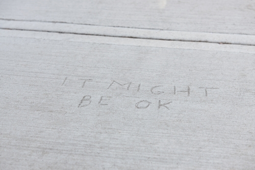 Written message in concrete pavement - Australian Stock Image