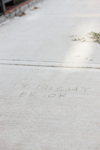 Written message in concrete pavement - Australian Stock Image