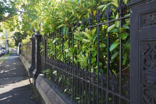 Wrought iron fence and footpath in exclusive Melbourne suburb