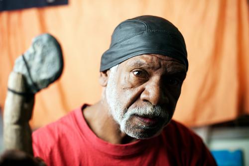 Wurundjeri Aboriginal Elder on Orange Background - Australian Stock Image
