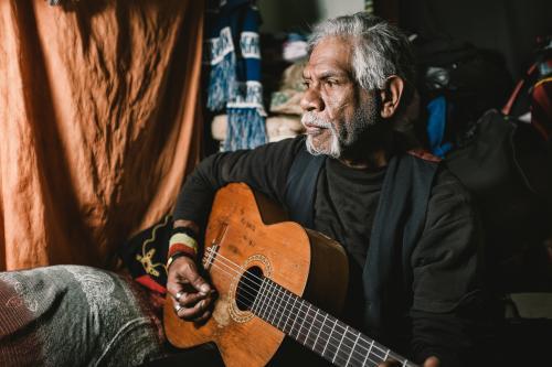 Wurundjeri Elder Playing Guitar - Australian Stock Image