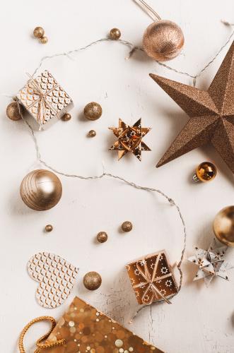 xmas flatlay with bronze or copper coloured ornaments - Australian Stock Image