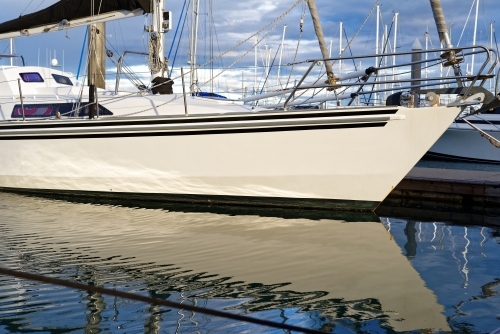 Yacht sail boat anchored at Hervey Bay Marina in tranquil waters - Australian Stock Image