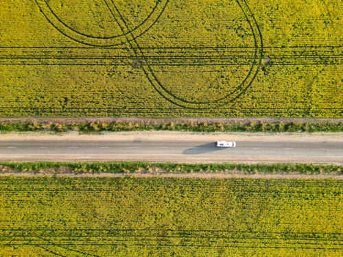 Yorke Peninsula canola paddocks and road from drone - Australian Stock Image