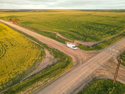 Yorke Peninsula canola paddocks and road from drone - Australian Stock Image