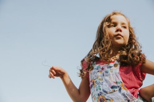 You girl posing with attitude looking away from the camera - Australian Stock Image