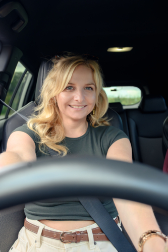Youn caucasian woman driving a car - Australian Stock Image